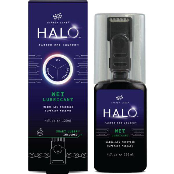 Finish Line Halo Wet Lubricant for bicycle chains with Smart Luber™ in a workshop setting, showing the lubricant bottle and chain.