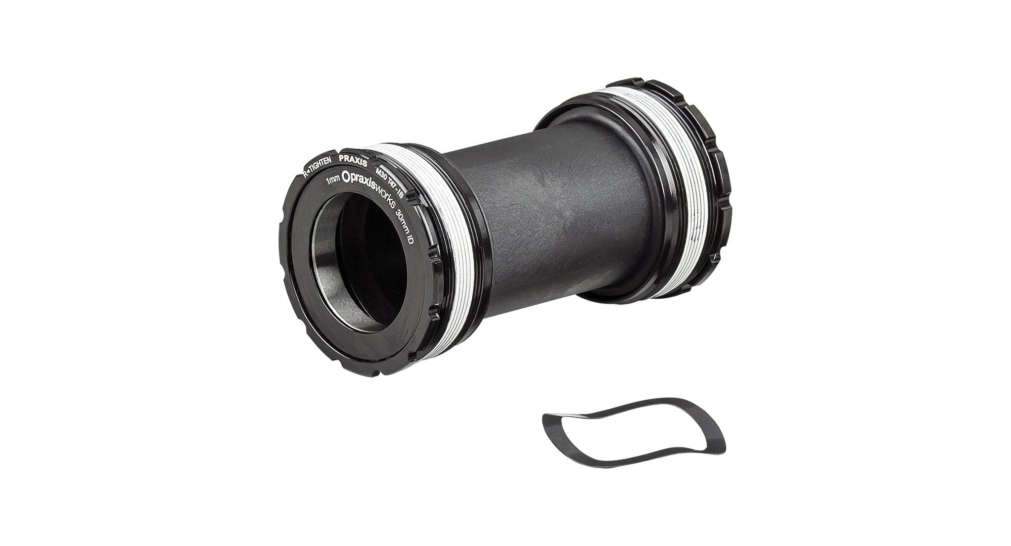 Trek Praxis M30 T47 inboard bottom bracket in black with 85.5mm shell width, shown with no axle, for bicycle components.