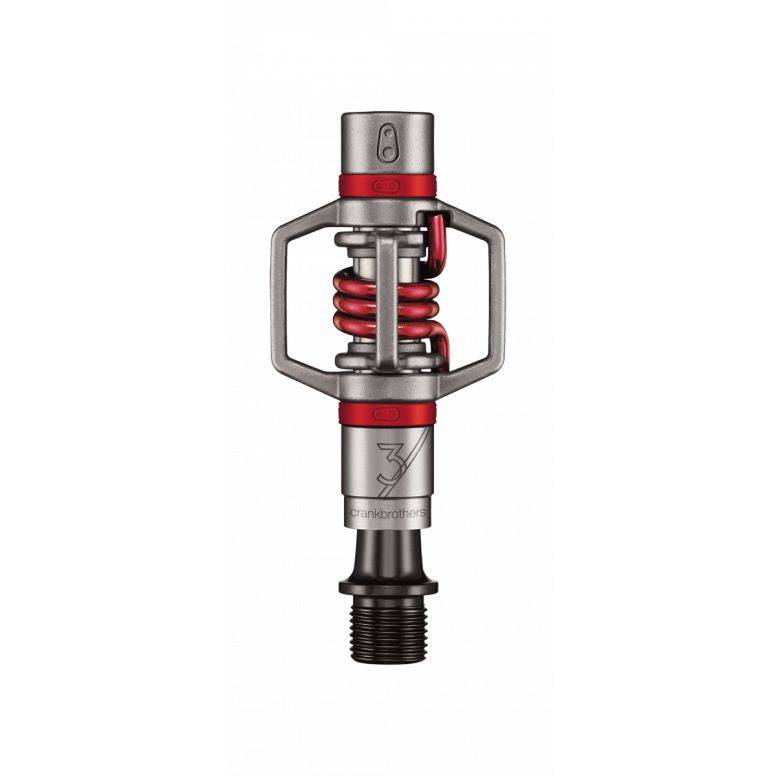 Crankbrothers Eggbeater 3 silver and red MTB pedals with mud-shedding design, showcasing lightweight cycling component features.