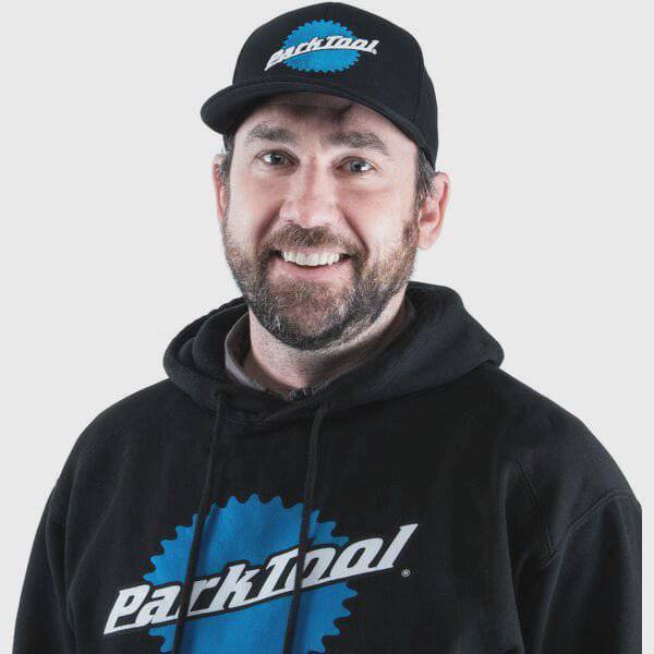 Park Tool HAT-11 adjustable snapback ball cap with embroidered logo, accessory hat featuring a classic design and adjustable fit.