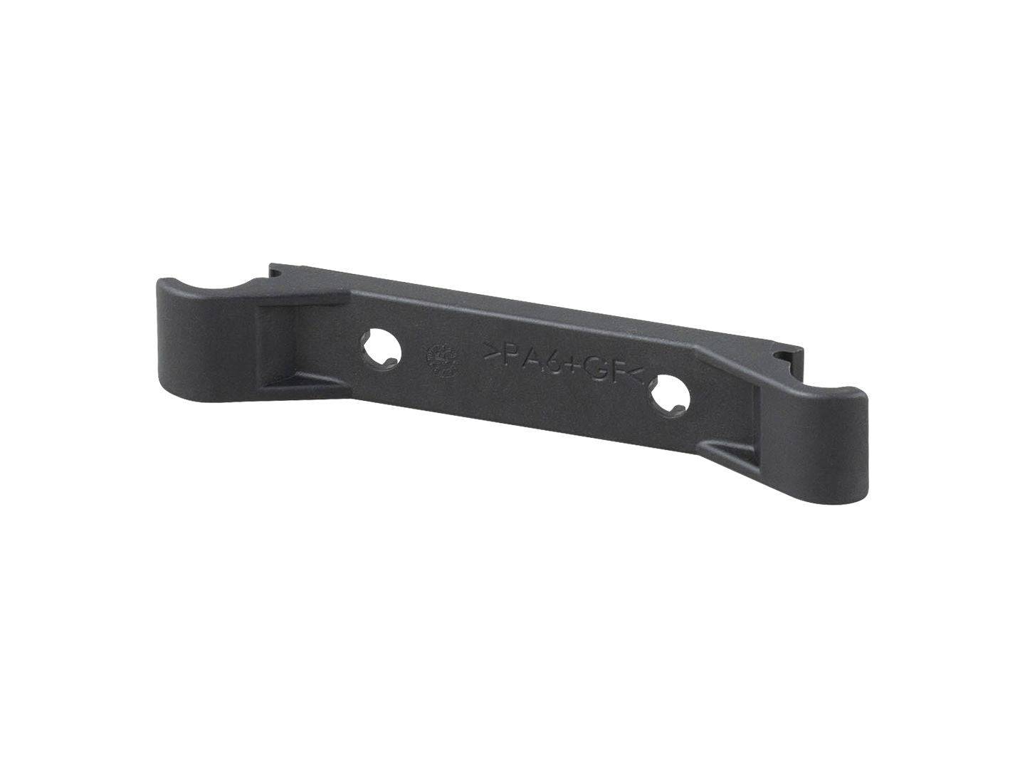 Trek Marlin+ motor armor spacer replacement for frame protection, shown as a small black component for bike maintenance.