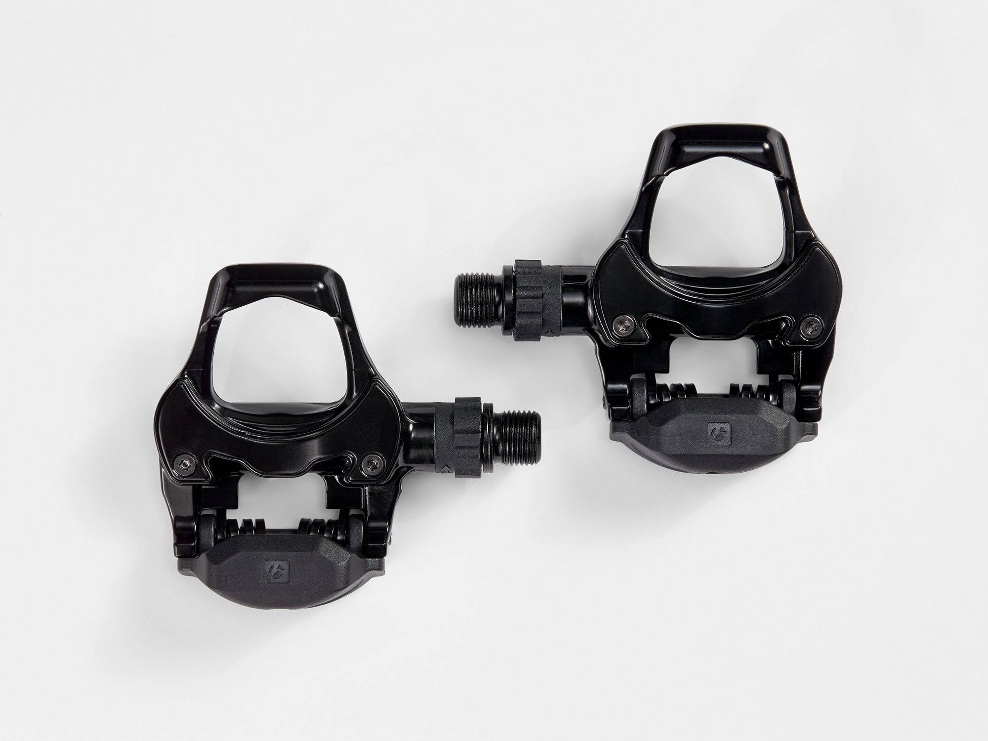 Bontrager Comp Road Pedal Set in black with 9/16-inch threading, compatible with Look Kéo cleats, shown with cleats attached.