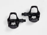 Bontrager Comp Road Pedal Set in black with 9/16-inch threading, compatible with Look Kéo cleats, shown with cleats attached.