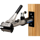 Park Tool PRS-4W-1 Deluxe wall-mount bike repair stand with 100-3C clamp for workshop bike maintenance and repairs.