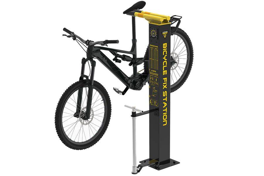 Topeak bicycle workshop fix station with multi-tool set, tire gauge, and pump in black, ideal for bike repairs and maintenance.