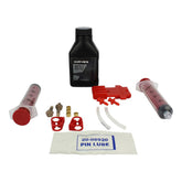 Hayes Dominion bleed kit with DOT 5.1 brake fluid for disc brake maintenance, showing brake fluid bottles and bleeding tools.