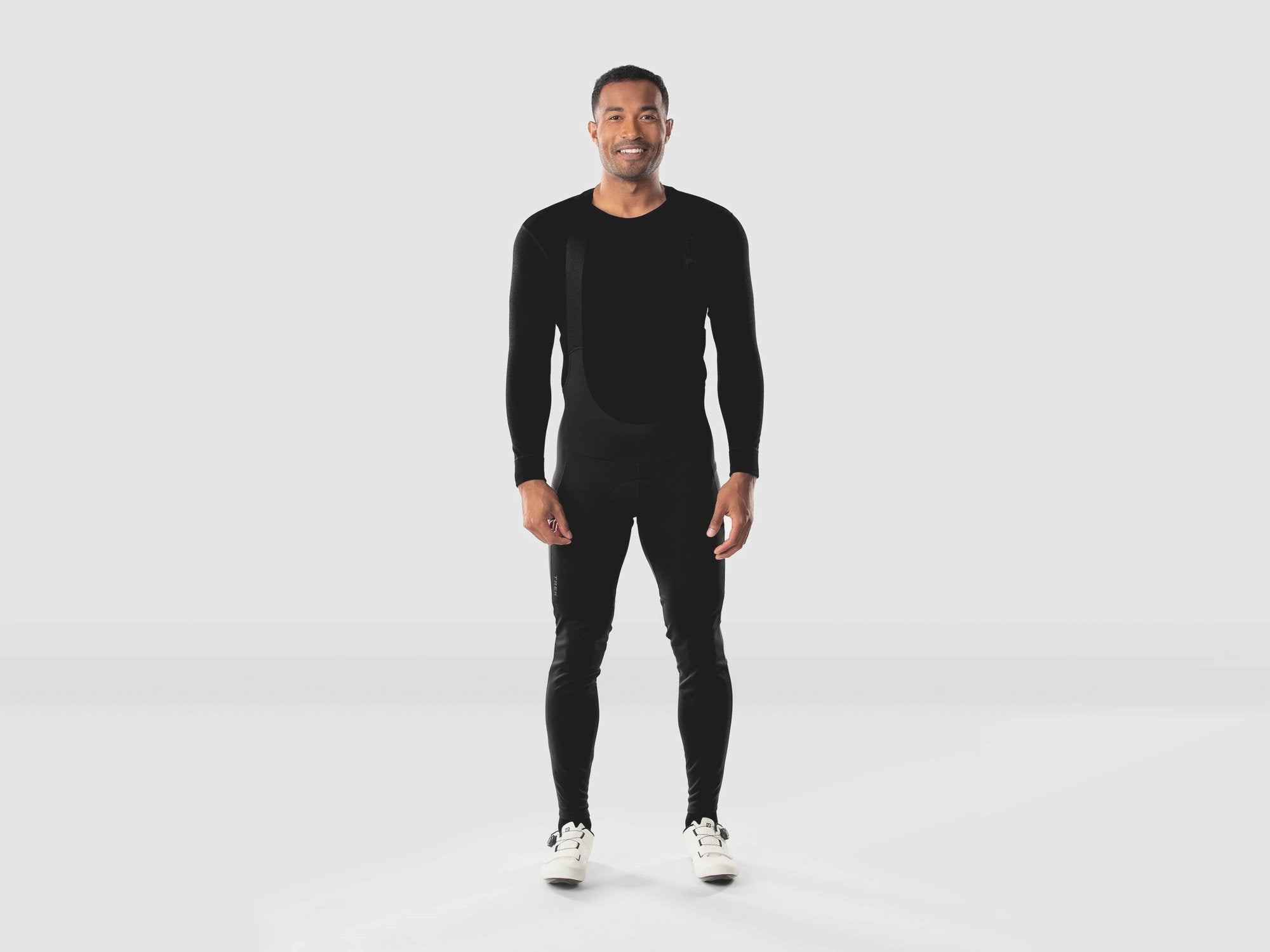 Trek Circuit softshell cycling bib tights with windproof, water-resistant, and thermal features, designed for cold weather riding.