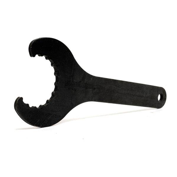 Shimano Workshop HollowTech II bottom bracket spanner tool for bike maintenance, shown in a workshop setting.