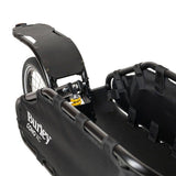 Burley Coho XC cargo bike trailer with suspension and quick release lever, showing its durable construction and loading area.