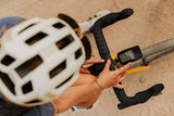 Coros DURA Solar GPS bike computer with dual-frequency GPS and navigation, showing a screen with ride data and battery status