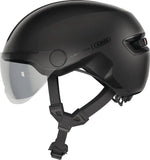 ABUS HUD-Y ACE urban cycling helmet with adjustable visor and rechargeable rear LED light, designed for safe city riding.