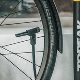 Yellow Topeak JoeBlow Sport EX floor pump with SmartHead for Presta and Schrader valves, featuring digital gauge and ergonomic handle.