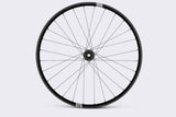Crank Brothers Synthesis Alloy Enduro MTB front wheel with CB hub, showing alloy rim and hub details in close-up image.