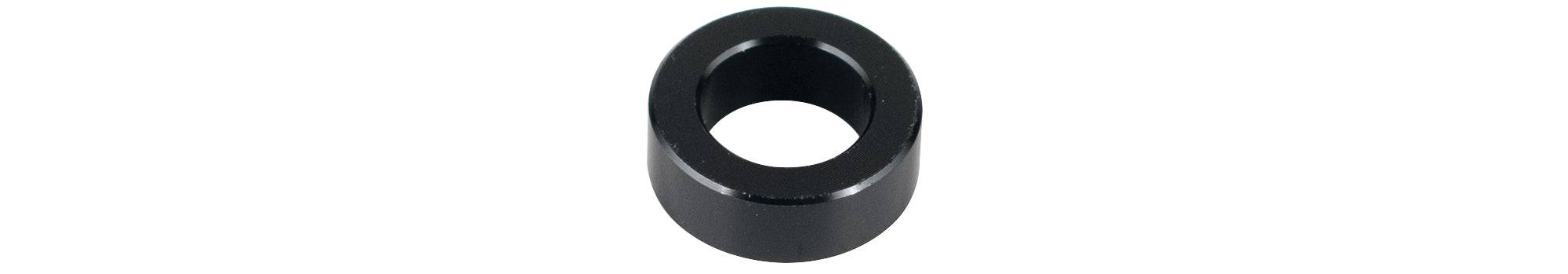 Trek Rocker Link Spacer 5.7mm x 10mm black component for full-suspension bikes, shown in close-up view.