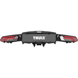 Thule Epos 3-bike towball carrier with 13-pin connector, shown mounted on a vehicle for secure bike transport.