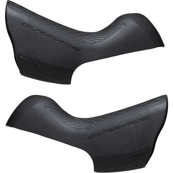 Pair of Shimano Dura-Ace ST-9100 bracket covers for shifter protection and replacement, shown on a bicycle component.