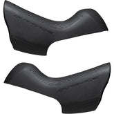 Pair of Shimano Dura-Ace ST-9100 bracket covers for shifter protection and replacement, shown on a bicycle component.