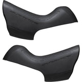 Pair of Shimano Dura-Ace ST-9100 bracket covers for shifter protection and replacement, shown on a bicycle component.