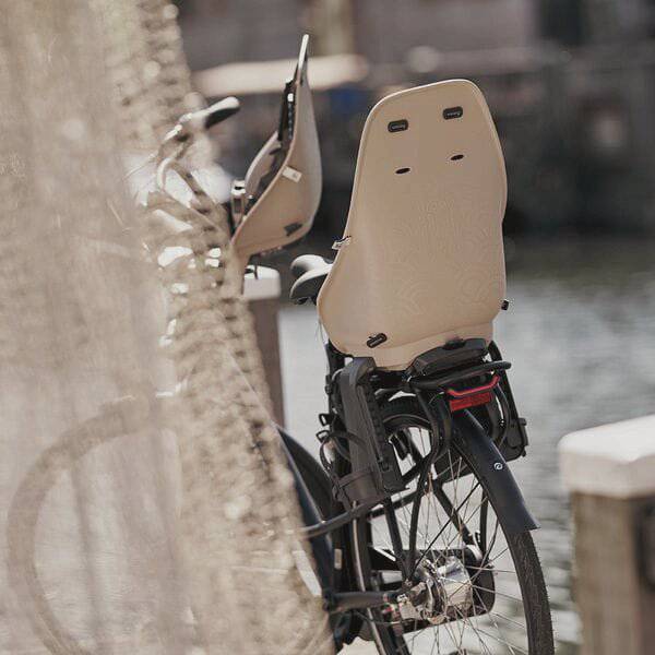Urban Iki rear bike child seat with easy fix mount, compatible with e-bikes and pannier racks, shown installed on a bicycle.