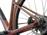 Liv Devote Advanced Pro 2026 women’s gravel racing bike with adjustable wheelbase, shown in a side view with sleek frame and rugged tires.
