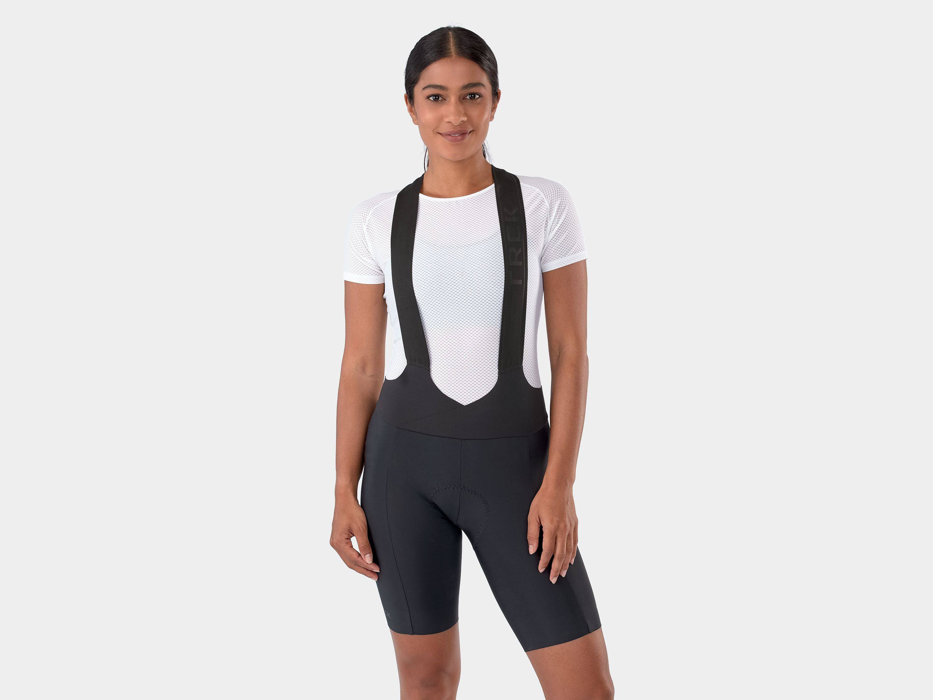 Trek Velocis Women's cycling bib shorts in breathable, eco-friendly performance gear with adjustable straps and padded seat.