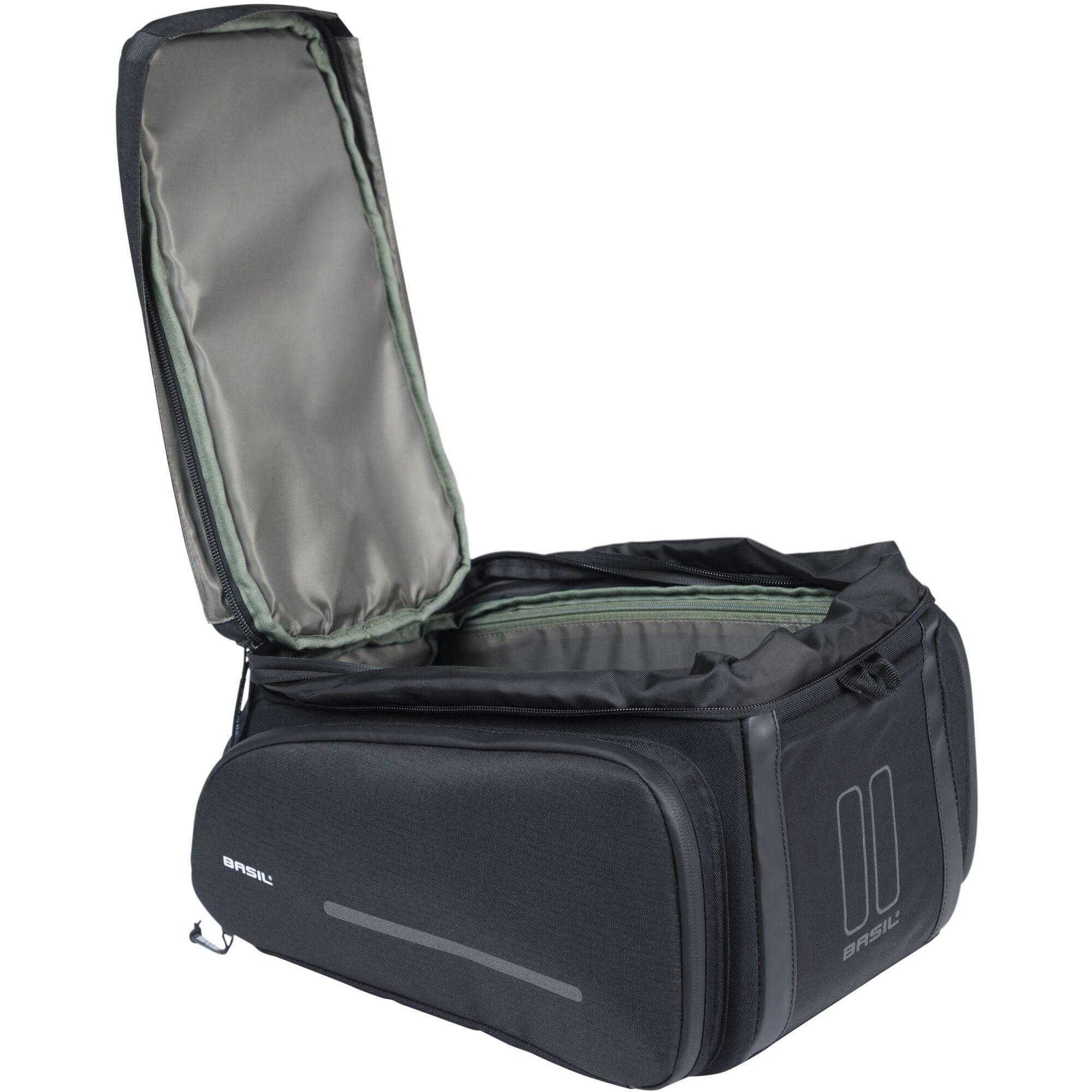 Black Basil Move Trunkbag MIK bike bag with expandable design and adapter plate, mounted on a bicycle for cycling accessories.