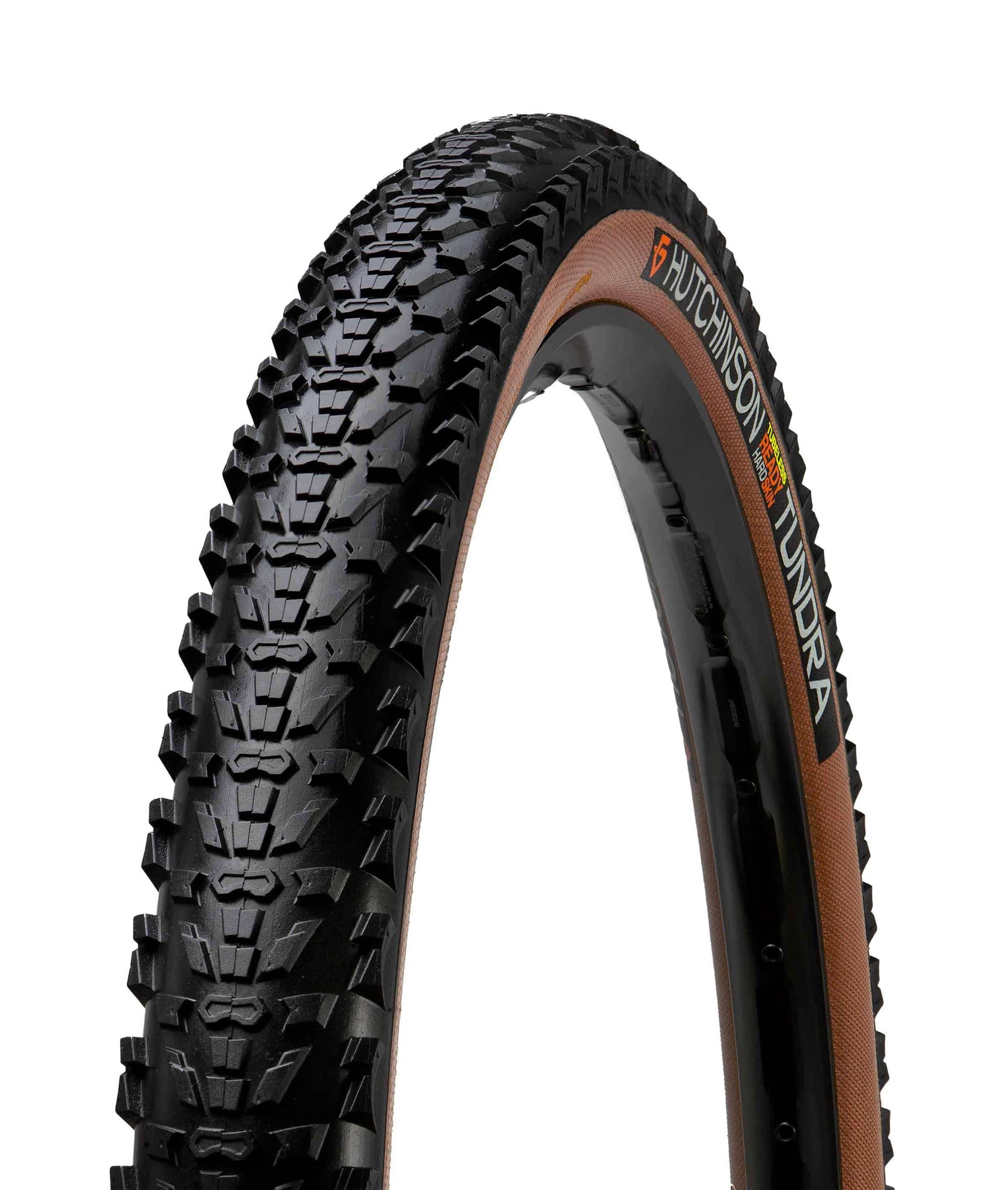 Hutchinson Tundra gravel tyre 700x50 with tan wall, tubeless-ready design, mounted on a wheel for gravel cycling.