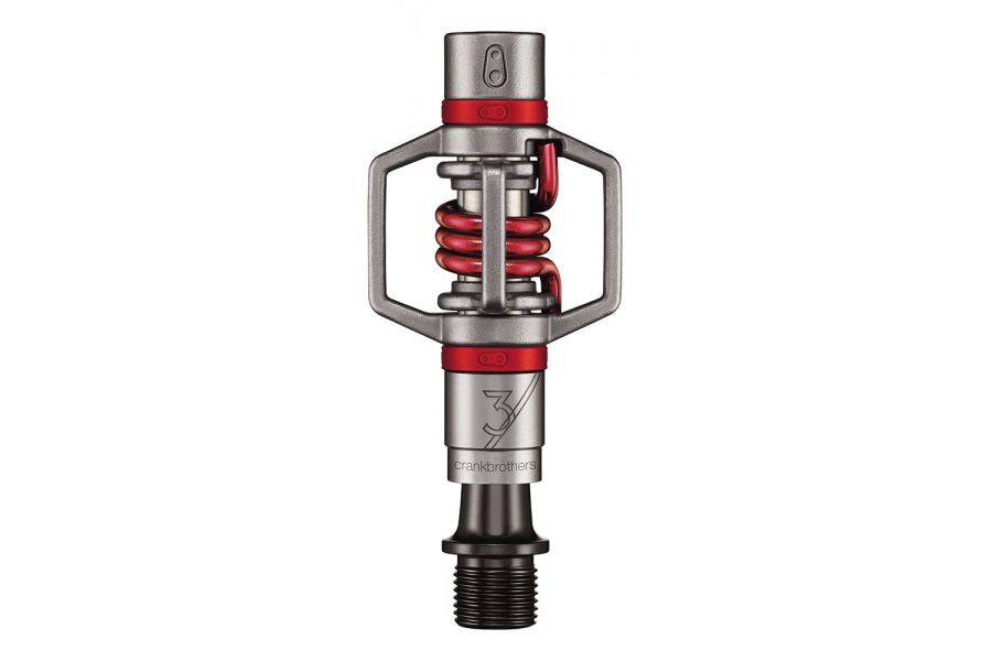 Crankbrothers Eggbeater 3 silver and red MTB pedals with mud-shedding design, showcasing lightweight components for mountain biking.
