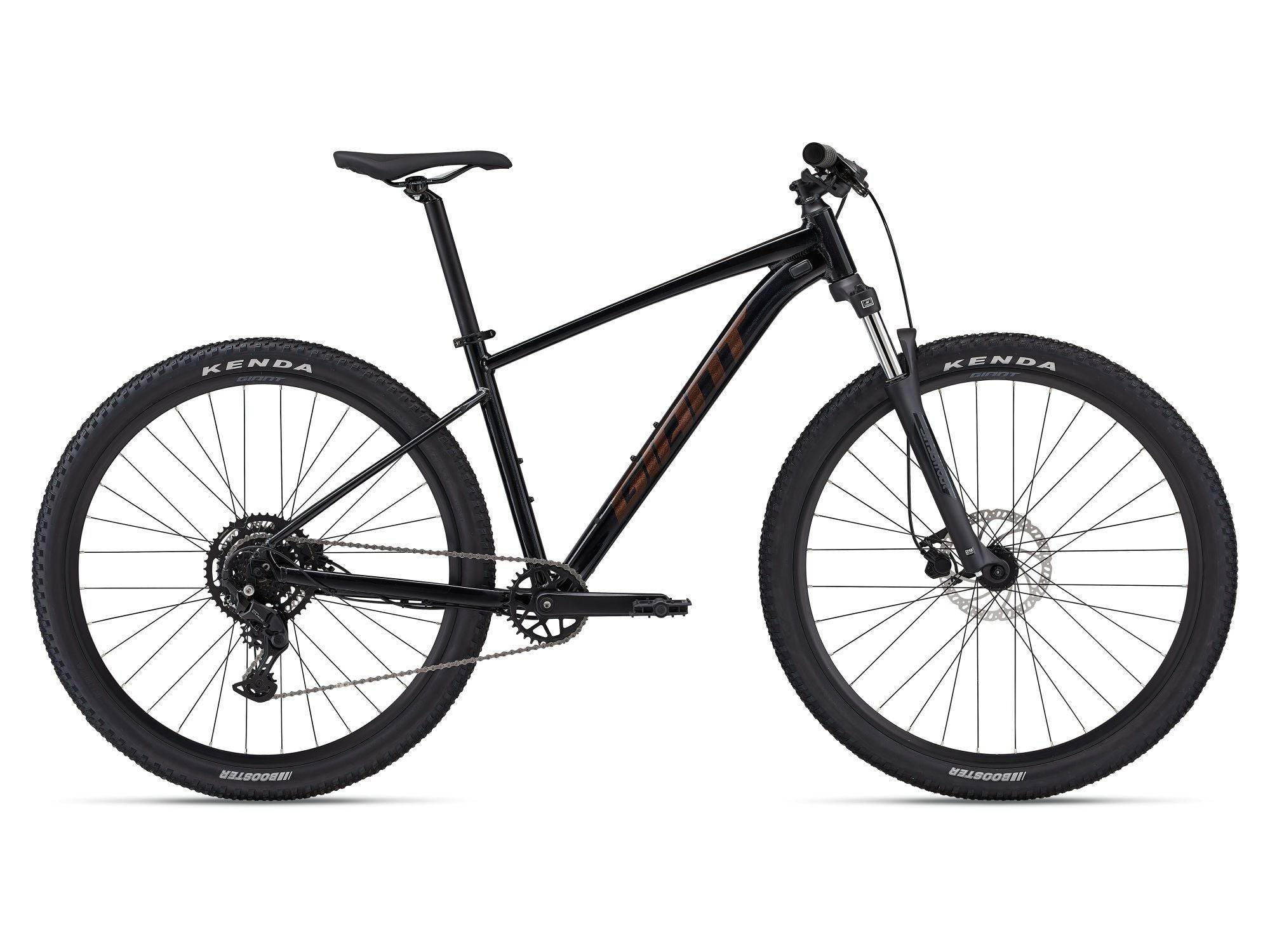Giant Talon 2 2024 mountain bike with Shimano CUES U4000 drivetrain and disc brakes, shown outdoors on trail.
