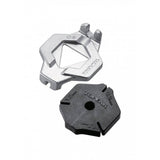 Topeak Duo Spoke Wrench tool for bike wheel spoke adjustments, shown in a workshop setting with the wrench in hand.