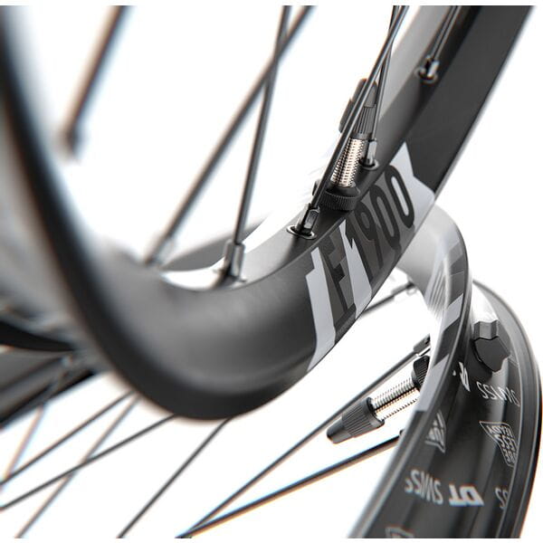 DT Swiss F 1900 27.5-inch front mountain bike wheel with 30mm rim, BOOST axle, featuring a sleek black design and robust construction