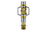 Crankbrothers Eggbeater 11 gold XC racing pedals with brass cleats and mud shedding design, shown with clipless pedal components.