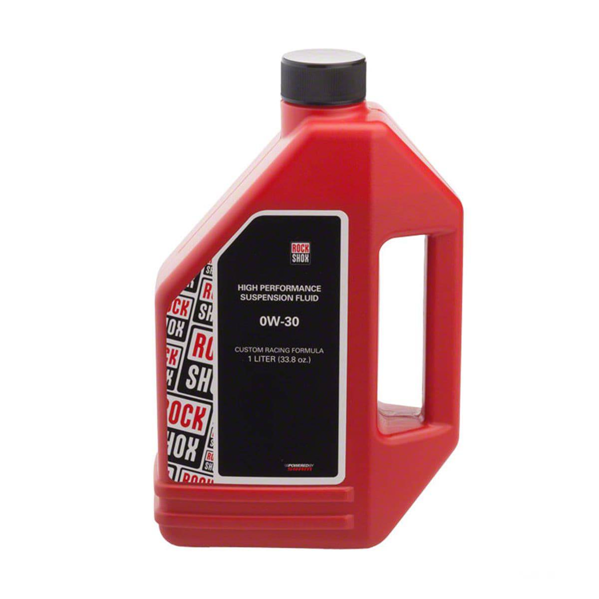 RockShox suspension oil 0-W30 in a 1-litre bottle, used for bike fork maintenance, displayed in a workshop setting.