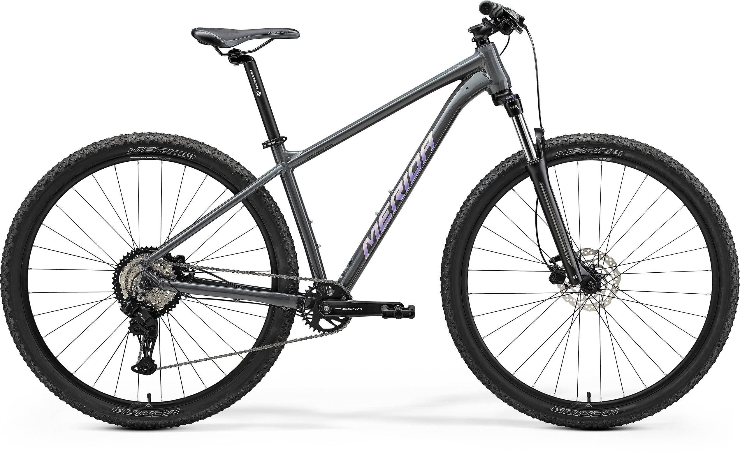 Merida Big Nine 20 aluminium mountain bike with Shimano CUES U2000 components and inboard disc brakes, positioned on trail.