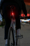 Knog Frog V3 rechargeable bike light set in denim blue, front and rear lights for cycling safety and visibility.