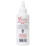 Effetto Mariposa Flowerpower Eco-Friendly Bicycle Chain Lube wax applied to a bike chain in a workshop setting.