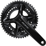 Shimano 105 FC-R7100 double 12-speed road bike crankset with HollowTech II design and crank arms on a bike component display.