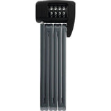 ABUS Foldable Bordo Lite 6055C/85 BK BK lightweight bike lock with digital code, folded and secured in a compact form.