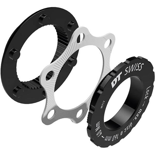 DT Swiss Centre-Lock to 6-bolt rotor adapter for road bike hubs, compatible with QR, 9mm, and 12mm axles, mounted on a wheel hub