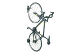 Topeak Swing-Up wall mount bike holder with rubber bar and rear wheel pad, black bike storage accessory for secure wall mounting.