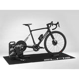 Elite Training folding mat for indoor cycling, providing floor protection and stability during workouts.