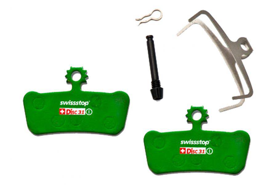 SwissStop Disc 31 brake pads for SRAM MTB G2, Guide, and Level Green disc brakes, shown installed on a bicycle rotor.