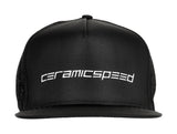 CeramicSpeed black flat brim cap with adjustable snapback, featuring a classic baseball style and branding on the front.