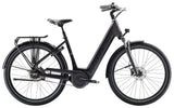 Trek District+ 4 Guard lowstep electric hybrid bike for urban commuting, with step-through frame and integrated battery.