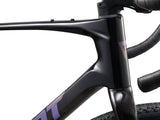 Giant Revolt Advanced 2 gravel bike with adjustable wheelbase and integrated storage, featuring a sleek frame and knobby tires.