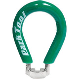 Park Tool SW-1 spoke wrench with green vinyl handle, designed for precise bike wheel spoke adjustments in a workshop setting.