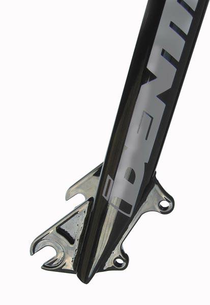 Identiti Rebate Jump 10mm MTB dirt jump forks with disc brake mounts, featuring a sleek black design and sturdy construction.