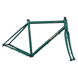 Green Surly Straggler gravel bike frameset with rack mounts, designed for mixed-terrain cycling and durable bike components.