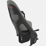 Thule Yepp 2 Maxi child bike seat with click-in system mounted on a rack, designed for secure and comfortable child transportation.