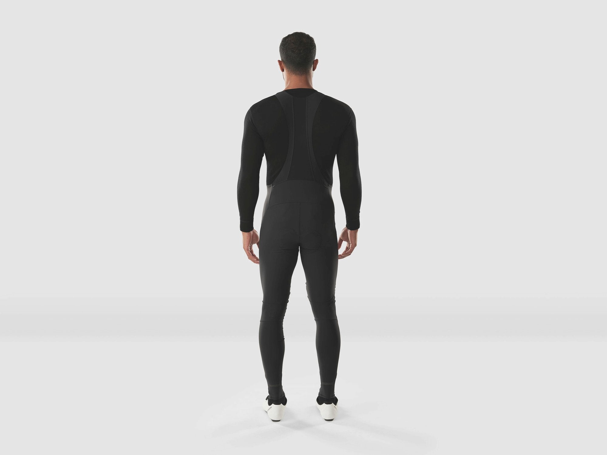 Trek Circuit Thermal Cycling Bib Tight Longs in black, featuring insulated fabric and adjustable straps for cold weather biking.